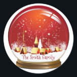 Sticker Rond Festif Red & White Christmas Village Snow Globe<br><div class="desc">Festive boule de neige du village de Noël avec ciel rouge et chute de neige. Personnalisez avec votre nom. Profite.</div>
