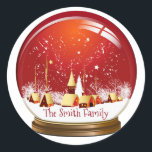 Sticker Rond Festif Red & White Christmas Village Snow Globe<br><div class="desc">Festive boule de neige du village de Noël avec ciel rouge et chute de neige. Personnalisez avec votre nom. Profite.</div>