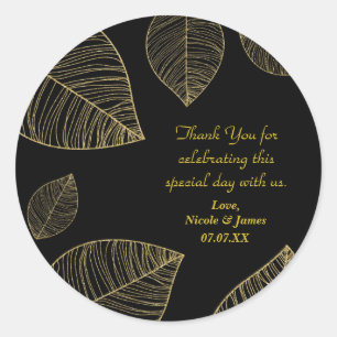 Sticker Rond Feuilles dorées sur un élégant cadeau de mariage n