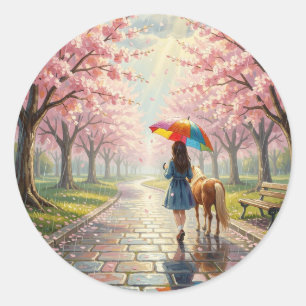 Sticker Rond Fille avec parapluie et poney dans un parc pluvieu