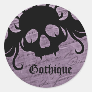Sticker Rond Gothic purple and black fanged skull