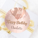 Sticker Rond Happy Birthday rose gold blush glitter balloons<br><div class="desc">A sticker for a girly and glamorous birthday party.  A faux rose gold metallic looking background with an elegant faux rose gold and pink glitter drips,  paint drip look and balloons.  The text: Happy Birthday is written with a golden balloon style font.  Personalize and add a name.</div>