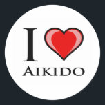 Sticker Rond J'aime l'aïkido<br><div class="desc">Aikido (合 気 道, Aikō ?) est un art martial japonais développé par Morihei Ueshiba comme synthèse de ses études martiales, de sa philosophie et de ses croyances religieuses. L'aïkido se traduit souvent par "la manière d'unifier (avec) l'énergie vitale"[1] ou "la manière d'être harmonieux"[2]. L'objectif d'Ueshiba était de créer un...</div>