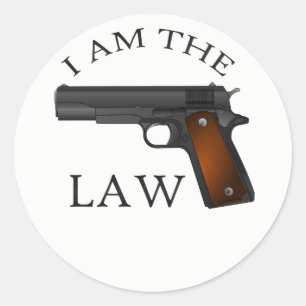 Sticker Rond Je suis la loi avec une arme à feu de main