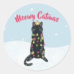 Sticker Rond Jeu de chat noir aux lumières de Noël drôle Noël