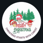 Sticker Rond Joli MERRY CHRISTMAS MUSHROOM Christian<br><div class="desc">Joli CHRISTMAS MUSHROOM Christian Holiday Stickers avec TEXTE PERSONNALISABLE. Idéal pour la famille, les amis, les collègues et les clients. Ce modèle saisonnier de cottagecore montre trois toadstools portant des chapeaux de Père Noël avec des glades de forêt bois dans l'arrière - plan. Le texte MERRY CHRISTMAS apparaît dans la...</div>