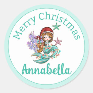 Sticker Rond Jolie sirène de Noël en chapeau de Père Noël sur f