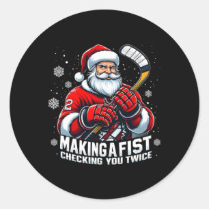Sticker Rond Joueurs de hockey Santa Xmas faisant une vérificat