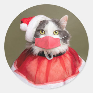 Sticker Rond Joyeux chat de Noël en tenue Père Noël et masque f