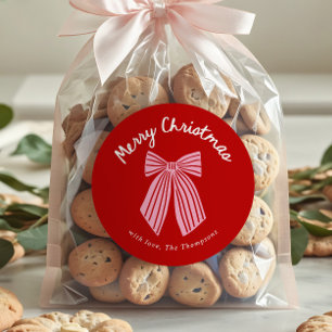 Sticker Rond Joyeux Noël avec un nœud fantaisiste dessiné à la 