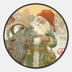 Sticker Rond Jultomten nourrit Yule Chèvre un biscuit