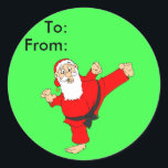 Sticker Rond Kicking Père Noël Martial Arts Christmas Cadeaux T<br><div class="desc">La ceinture noire Kicking Père Noël in a Martial Arts est présentée sur ces étiquettes de cadeau peel and stick. Remplissez les noms des espaces A et From pour donner des cadeaux à votre artiste martiale à l'heure de Noël. Les cartes de Noël et les timbres-poste correspondants sont également disponibles...</div>
