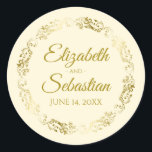 Sticker Rond Lacy Gold Filigree Elegant Cream Wedding Favor<br><div class="desc">Ces beaux autocollants sont dotés d'un texte doré sur un arrière - plan crème ou ivoire avec une bordure florale en faux feuille d'or. Le texte est entièrement personnalisable et contient les noms du couple mariage et la date du mariage. Super comme étiquettes de faveur!</div>