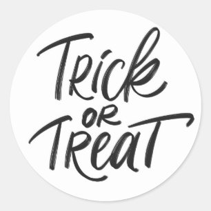 Sticker Rond Laisser tomber ou traiter la main en noir Hallowee