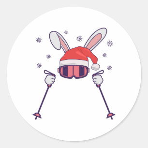 Sticker Rond Lapin de Noël skieur avec chapeau de Père Noël et
