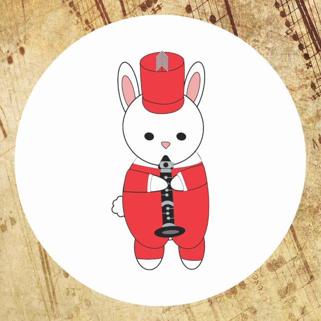 Sticker Rond Lapin Lapin Clarinet Marche Band Rouge Blanc (A sticker with a marching band rabbit playing the clarinet in a red and white uniform.)