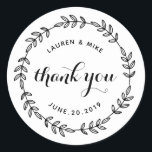 Sticker Rond Laurel Wreath Wedding Favor Merci<br><div class="desc">Conçu sur mesure pour un mariage rond, merci les autocollants/étiquettes avec une couronne botanique rustique dessinée à la main. Personnalisez avec le nom du couple/épouse et du marié et la date du mariage. Ces autocollants élégants et fantaisistes sont parfaits pour ajouter une touche de style aux enveloppes mariages, aux cartes,...</div>