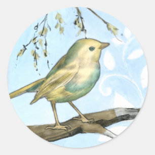 Sticker Rond Le petit oiseau jaune était perché sur une branc