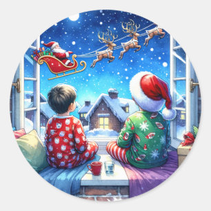 Sticker Rond Les enfants regardent Père Noël le soir de Noël