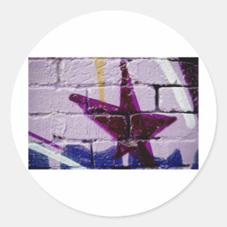 Sticker Rond L'étoile graffiti Abstraite sur le mur texturé