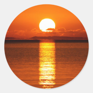 Sticker Rond Lever de soleil tropical dans l'orange