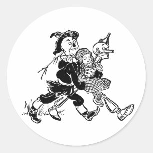 Sticker Rond Mage de l'Oz vintage Dorothy dormant avec des pavo