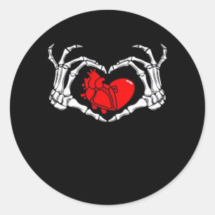 Sticker Rond Mains De Squelette Effrayant Et Coeur Rouge Déplai