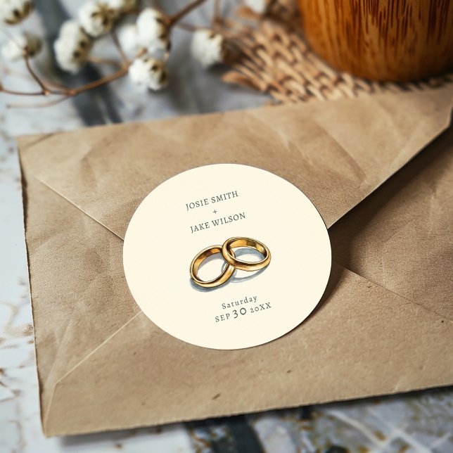 Sticker Rond Mariage des anneaux de mariage coupé (Delicate gold rings on a muted background sticker, evoking elegance and serene romance for weddings.)