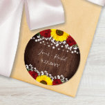 Sticker Rond Mariage Sunflowers Red Roses<br><div class="desc">Ce design autocollant mariage présente de jolies roses rouges peintes, le souffle du bébé, des tournesols et des lampes à cordes sur un arrière - plan rustique en bois foncé. Cliquez sur le bouton personnaliser pour plus de flexibilité dans la modification du texte. Des variantes de cette conception, différents types...</div>