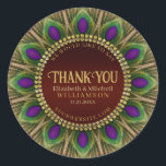 Sticker Rond Merci Mandala aux plumes de paon doré<br><div class="desc">Conception audacieuse et magnifique : Texte personnalisable avec un cercle de plumes de paon. Couleurs vertes et violettes magnifiques avec des garnitures dorées riches. | Ces détails et nom personnalisés décoratifs créent un design exceptionnel pour de nombreux événements spéciaux - entièrement personnalisable ♥ Cadeaux souvenirs de fiançailles / mariage (ou...</div>