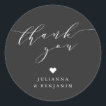 Sticker Rond Minimalist Elegant Heart Custom Black Thank You<br><div class="desc">This bridal shower favor sticker features flowing script lettering on a classic black background for a modern, understated look. The round design adds a soft, elegant finishing touch to favors, gift bags, boxes, or candles. Simple yet refined, it pairs beautifully with monochrome, minimalist, or contemporary bridal shower décor. A timeless...</div>