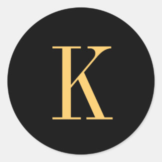 Sticker Rond Monogramme K couleur or sur arrière - plan noir