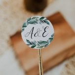 Sticker Rond Monogramme Mariage de feuillage abondant<br><div class="desc">Des autocollants botaniques élégants pour vos invitations de mariage ou vos faveurs présentent vos initiales dans la typographie de script de calligraphie lettrée à la main,  entourée d'un feuillage vert d'aquarelle luxuriant et de branches. Conçu pour coordonner avec notre mariage Abondant Foliage et notre collection d'invitations d'évènements.</div>