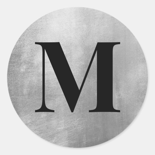 Sticker Rond Monogramme noir sur feuille de faux argent (Devant)