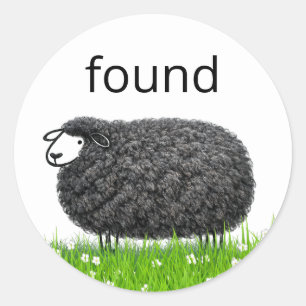 Sticker Rond Mouton Noir Laineux Dans L'Herbe avec Texte "Trouv