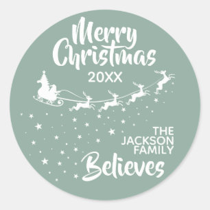 Sticker Rond Noël Père Noël vacances pour les rennes de traînea