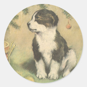 Sticker Rond Noël vintage, chiot mignon sous l'arbre de Noël