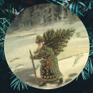 Sticker Rond Noël vintage, le Père Noël porte un arbre