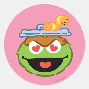 Sticker Rond Oscar Souriant visage avec des yeux en forme de co