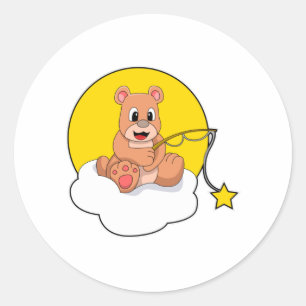 Sticker Rond Ours à la pêche avec une canne à pêche sur un nuag