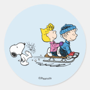 Sticker Rond Peanuts Snoopy, Sally et Linus en traîneau