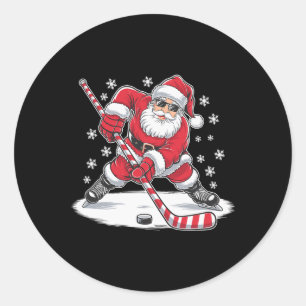 Sticker Rond Père Noël de Noël drôle jouant au hockey sur glace