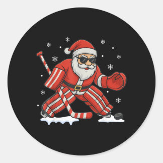 Sticker Rond Père Noël jouant au gardien de but de hockey sur g