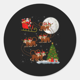Sticker Rond Père Noël singe traîneau volant drôle Noël magique