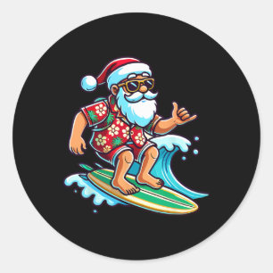 Sticker Rond Père Noël surfant cool Noël de juillet sur la plag