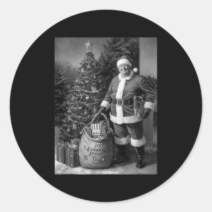 Sticker Rond Père Noël Trump avec un sac plein de cadeaux de No