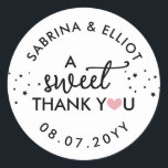 Sticker Rond Pink Heart A Sweet Thank You Wedding Favor<br><div class="desc">A sweet thank you wedding favor sticker with a pink heart replacing the O in you with your names in curved text along with your wedding date in black fonts against a white background.</div>