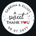Sticker Rond Red Heart A Sweet Thank You Wedding Favor<br><div class="desc">A sweet thank you wedding favor sticker with a red heart replacing the O in you with your names in curved text along with your wedding date in black fonts against a white background.</div>