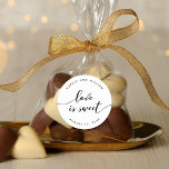 Sticker Rond Relax Script Love is Sweet Wedding Favor<br><div class="desc">Un autocollant de faveur de mariage avec les mots "l'amour est doux" dans un script de relaxation cursive en noir contre un arrière - plan blanc. Personnalisez-le en remplaçant le texte de l'espace réservé. Pour plus d'options comme changer la police et sa taille/couleur, développer la courbe /contrat ou l'espacement entre...</div>