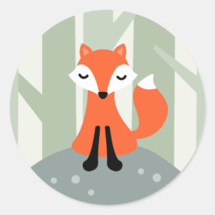 Sticker Rond Renard mignon se reposant sur une roche dans la